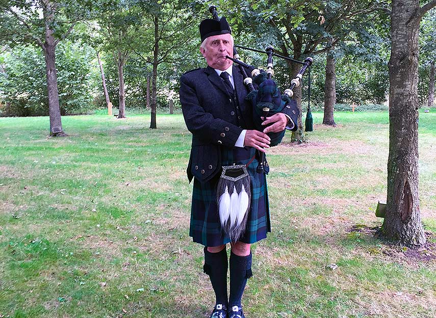 bagpipes accompany the funeral service at the UKs woodland burial ground here in Bedfordshire